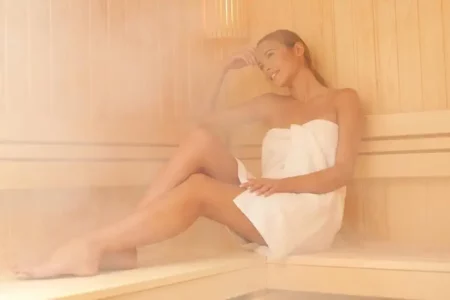 a women sit in sauna home steam bath